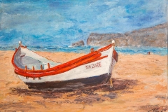 Traditional fishing boat on Nazare Beach Portugal