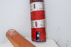Candy striped lighthouse on curved tile